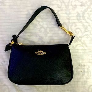 I am selling a new mini coach wallet, I have never used it.
